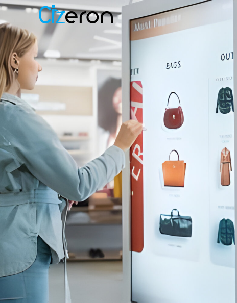 A woman watches a digital display