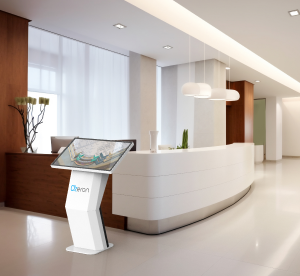 Office reception desk with interactive signage, including a touch screen for employee convenience.